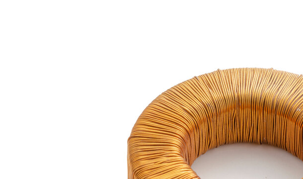 Electric transformer copper coil inductor on white background, close-up
