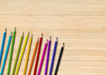 Colored pencil group isolated on wooden background. Horizontal background