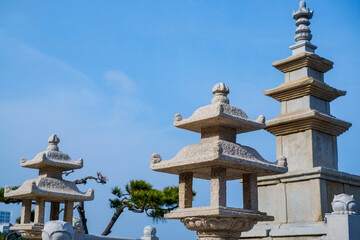 Stone tower with blue ocean at Haedong Yonggungsa Temple in Busan, Korea