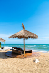 beach chair and umbrella with sea beach background