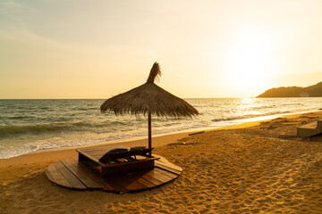 beach chair and umbrella with sea beach background