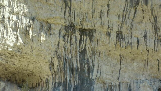 Aerial shot of a limestone cliff to climb in an arid landscape, Saint-L&eacute;ger du Ventoux, France