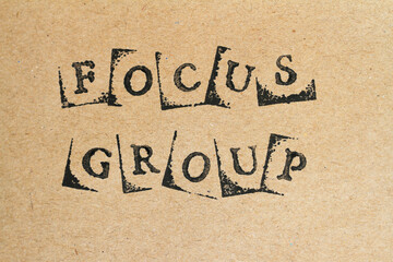 Words focus group made with letter stamps on recycled brown paper
