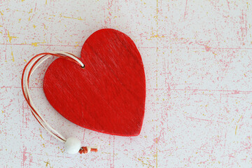 Red wooden heart on vintage surface with copy space
