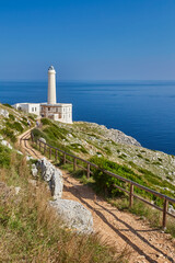 Fototapeta na wymiar Scenic view of cliff path on the sea Punta Palascia lighthouse on background. Otranto, Lecce