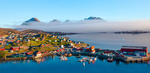 Picturesque village on coast of Greenland - Colorful houses in Tasiilaq, East Greenland © muratart