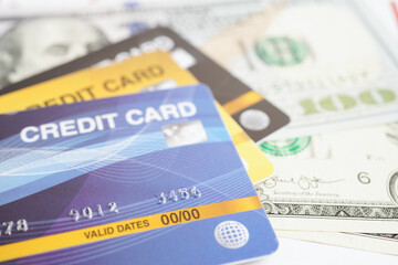 Credit card with password key lock and US dollar banknote money, security finance business concept.