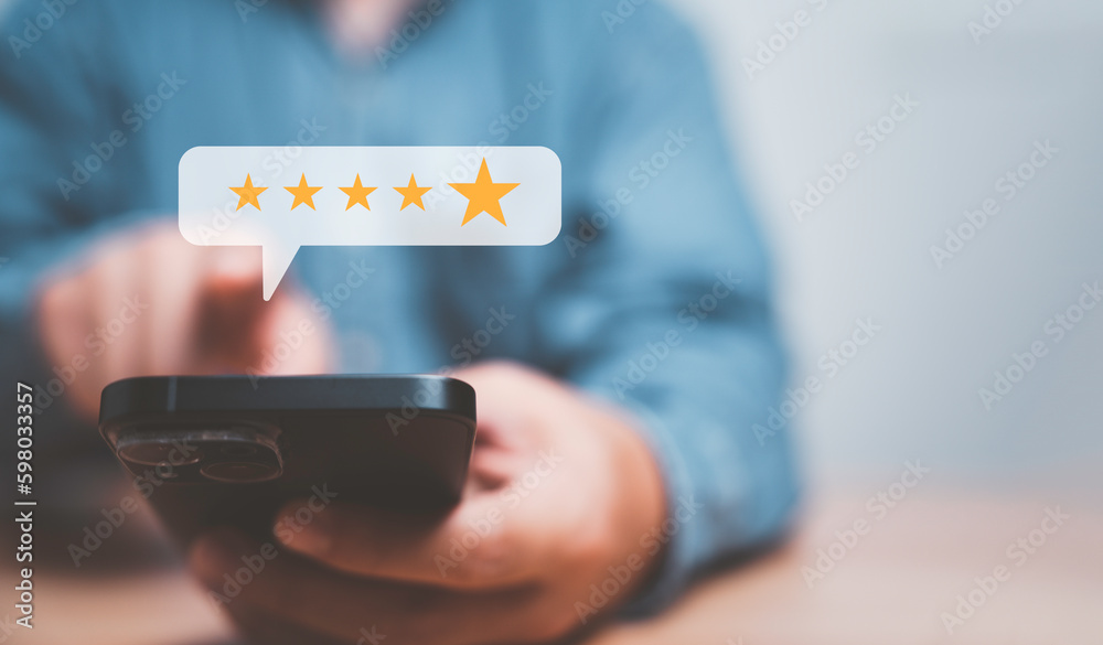 Poster Businessman using smartphone for giving golden five stars for excellent evaluate after customer use product service , ISO and quality standard certificate concept.