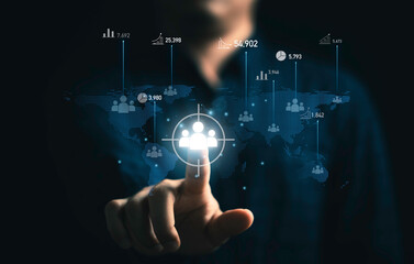 Businessman touching virtual human icon on world map for business CRM or Customer Relation Management and customer service concept by use social media technology.