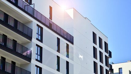 Modern apartment buildings on a sunny day with a blue sky. Facade of a modern apartment building. Contemporary residential building exterior in the daylight. 