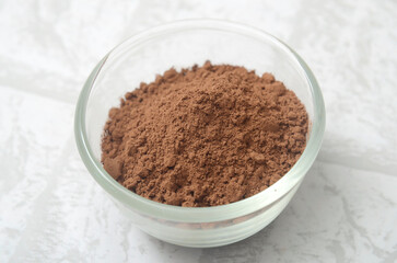 cocoa powder in a glass bowl, ingredient for baking, make a cake