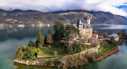 Fotobehang  scenic lakes of European Alps - beautiful Annecy with fairytale castle Duingt on the island. aerial panoramic view. France, haute-Savoie © Freesurf