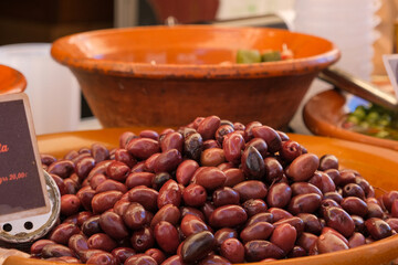 Large assortment of olives on a market in Spain.