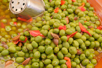 Green olives close-up on the market.