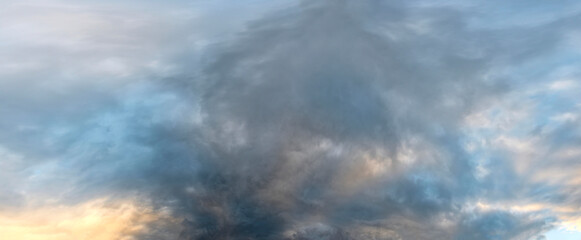 Russia. South of Western Siberia. Gloomy sunset clouds in the evening summer sky over the mountain ranges of Altai.