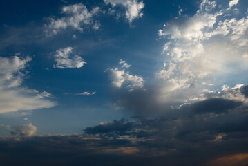 Obraz premium Russia. South of Western Siberia. Gloomy sunset clouds in the evening summer sky over the mountain ranges of Altai.