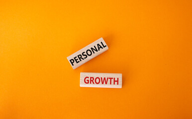 Personal growth symbol. Wooden blocks with words Personal growth. Beautiful orange background. Business and Personal growth concept. Copy space.
