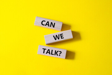 Can we talk symbol. Concept word Can we talk on wooden blocks. Beautiful yellow background....