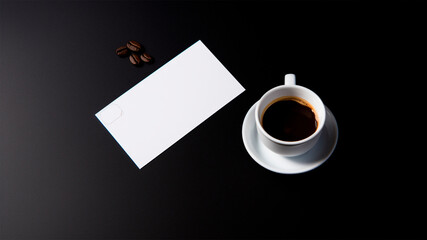 Coffee cup and blank business card on black background. Top view. generative ai.