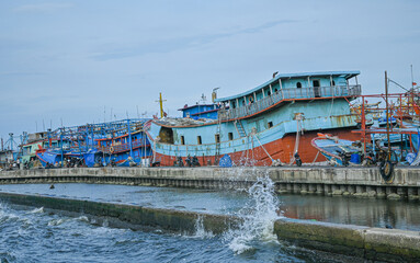 Fishing boats mooring at the port of Sunda head, North Jakarta, Indonesia, 23 April 2023