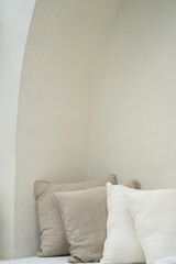 Pastel color, white a cushions or pillows setting on out sofa bed in modern luxury villa. Details of modern style design interior in modern, minimal, white Villa in Bali. Bohemian (Boho)  © Ruth