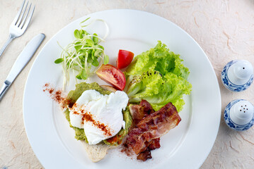 ix dish breakfast salad with fried egg, eggs Benedict, egg burrito, juice, toasted muffins, ham, poached eggs, and delicious buttery hollandaise sauce with fresh salad.