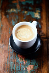 Cup of coffee on wooden background. Close up.	