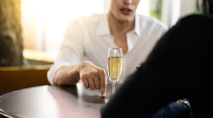 focus on Grass champagne. Celebration, Party People Christmas and Happy new year concept. Group Of Happy Friends Enjoying Evening Drinks in birthday party at the club.