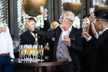 Masquerade party. Beautiful women and men wearing fantasy mask. Company employee enjoy drinking in mask party  together indoors celebration