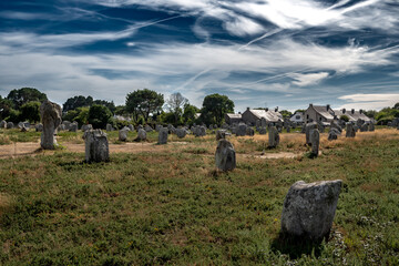 Ancient Stone Field Alignements De Menhir Carnac With Neolithic Megaliths And Old Cottage In Brittany, France