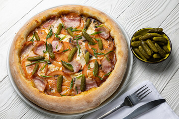 delicious pizza on a white wooden table. close-up
