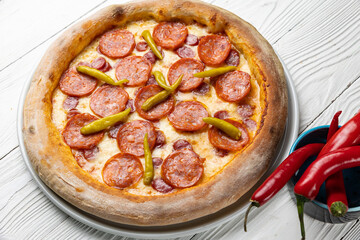 delicious pizza on a white wooden table. close-up
