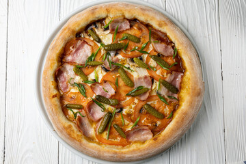 delicious pizza on a white wooden table. close-up
