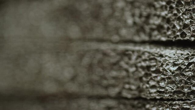 Abstract Black Porous Soundproofing Material Structure Macro Shot