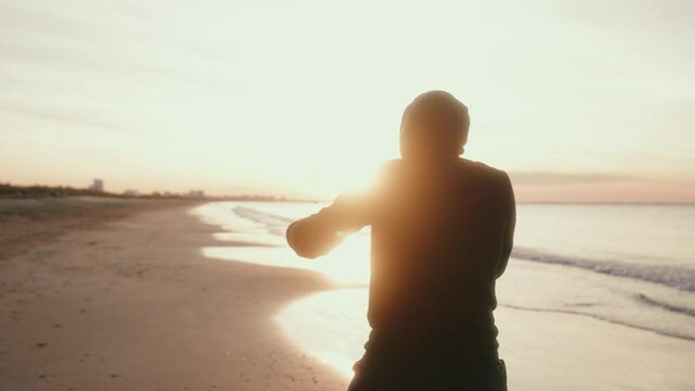 training of a boxer by the beach at sunrise