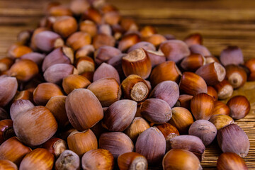 Pile of the hazelnuts on wooden table