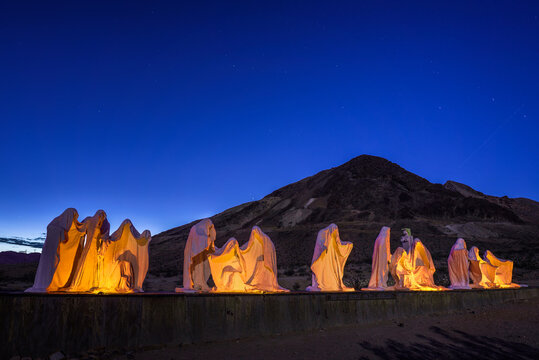 Rhyolite, Nevada, USA - October 23, 2018 : Creepy ghost sculptures in Rhyolite, a former mining town near Death Valley and now a ghost town.