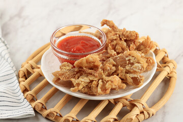 Crispy Fried Oyster Mushroom or Jamur Krispi. Oyster Mushroom Coated with Spiced Flour and Deep Fried.