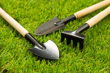 Gardening tools on  grass floor.