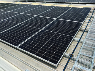 Install a solar panel system on the roof to generate electricity for use in the building.
