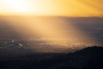 Naklejka premium The sun shines on the small village of Bischweier in the upper Rhine plain after a rain shower