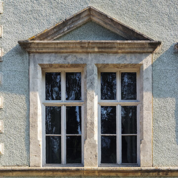 vintage windows on the old facade. abandoned architecture exterior