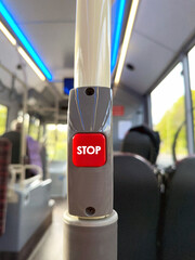 Push button on a public service bus to tell the driver to stop at the next bus stop.