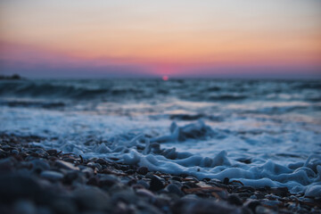 Detail of a wave during Sunset over Mediterranean Sea seen from Rhodes island
