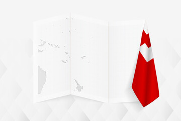 A grayscale map of Tonga with a hanging Tongan flag on one side. Vector map for many types of news.