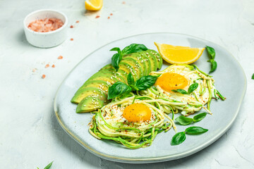 zucchini with eggs and avocado. breakfast. Healthy food, ketogenic diet, diet lunch concept. place for text, top view