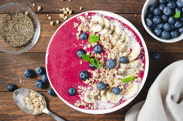 Blueberry Smoothie Bowl with Granola, Banana, and Chia Seeds, Healthy Food, Vegan or Vegetarian Diet Food Concept