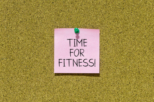 Time for fitness text on pink post-it paper pinned on bulletin cork board. This message can be used in business concept about time for fitness.