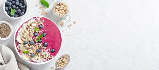Blueberry Smoothie Bowl with Granola, Banana, and Chia Seeds, Healthy Food, Vegan or Vegetarian Diet Food Concept