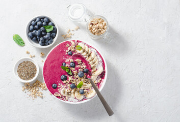 Blueberry Smoothie Bowl with Granola, Banana, and Chia Seeds, Healthy Food, Vegan or Vegetarian Diet Food Concept
